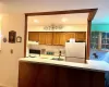 Appliances include refrigerator, electric range and dishwasher; subway style backsplash & recesses lighting.  Large countertop