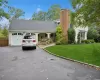 View of front of home with a garage and a front yard