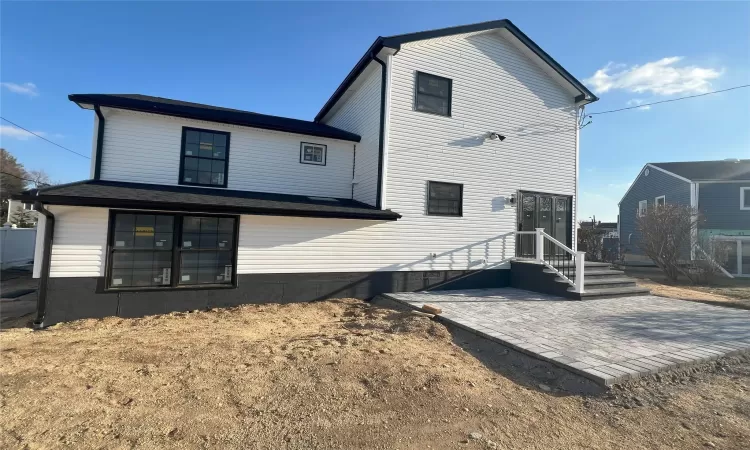 Back of property with a patio area