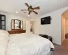 Bedroom featuring ceiling fan and carpet flooring