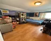 Bedroom with light hardwood / wood-style flooring