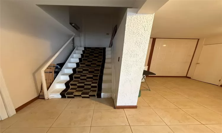 Staircase with tile patterned flooring