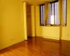 Unfurnished bedroom featuring a closet and hardwood / wood-style floors