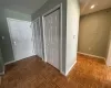 Hallway with parquet floors and electric panel