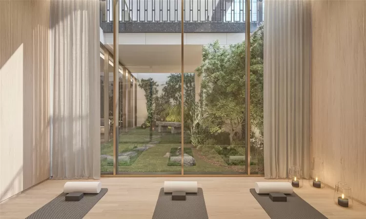 Exercise area featuring wood-type flooring