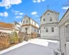 View of snow covered rear of property