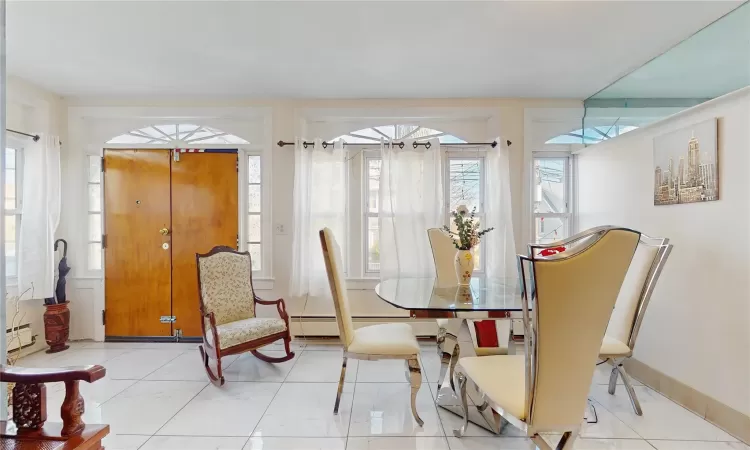 Dining space featuring a baseboard heating unit