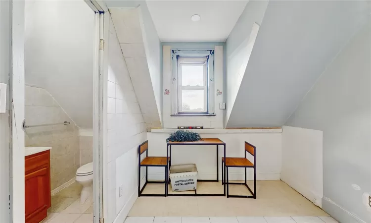 Bathroom featuring toilet and tile patterned floors