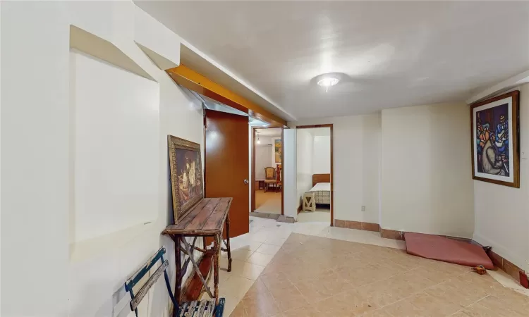 Corridor with light tile patterned floors