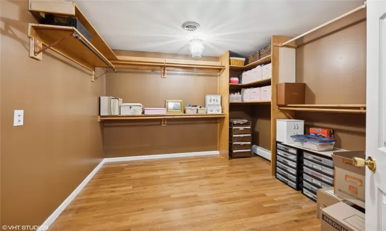 One of three very large walk-in closets in primary bedroom