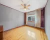 Unfurnished room with ceiling fan, crown molding, and light hardwood / wood-style flooring