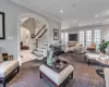 Living room featuring carpet and crown molding