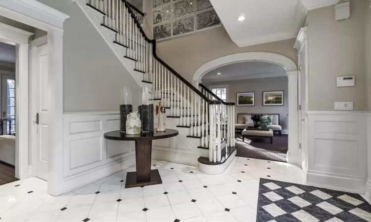 Foyer entrance with ornamental molding and ornate columns