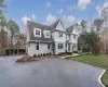 View of front of property with a front lawn and central air condition unit