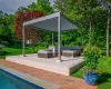 View of home's community with an outdoor hangout area, a yard, and a wooden deck