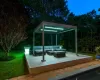 Wooden deck featuring a lawn and outdoor lounge area