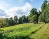 View of yard with a rural view