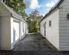 View of #77exterior featuring a garage and an outbuilding