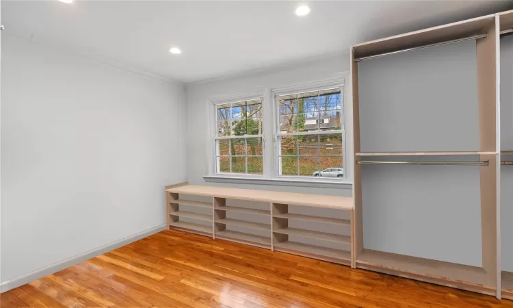 Walk in closet featuring light wood-type flooring