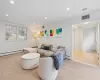 Tiled living room featuring a baseboard radiator