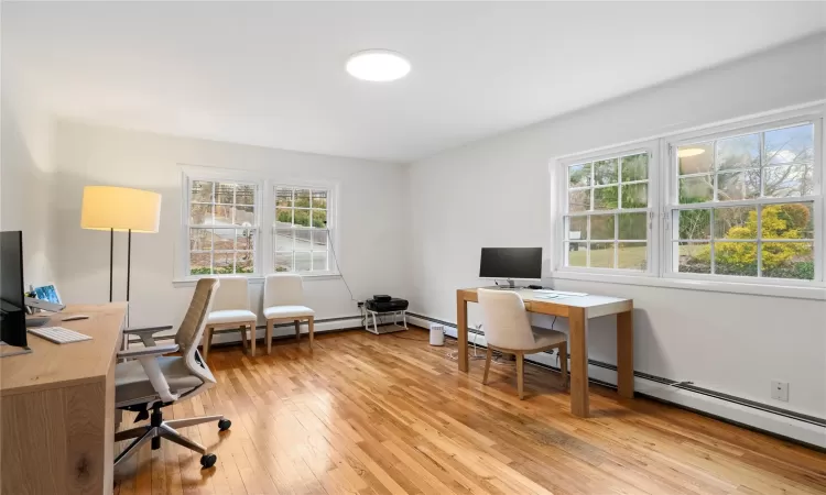 Office area featuring light hardwood / wood-style floors