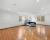 Unfurnished bedroom featuring a baseboard heating unit, crown molding, and light hardwood / wood-style floors