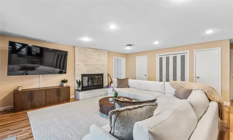 Living room featuring light hardwood / wood-style floors and a fireplace