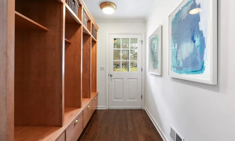 Mudroom with Access to Garage and Door to Driveway