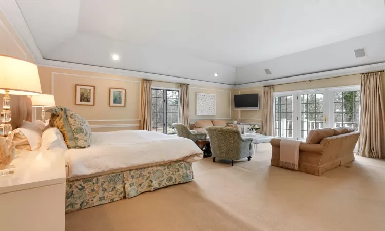 First Floor Primary Bedroom with Tray Ceiling and Seating Area