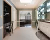 Primary Dressing Area with Vanity, Built-In Desk and Two Walk-In Closets