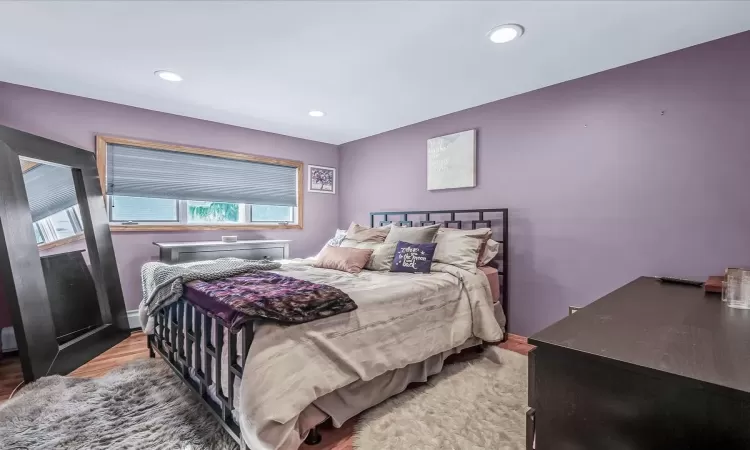 Bedroom with a notable chandelier