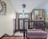 Dining area featuring vaulted ceiling, plenty of natural light, french doors, and hardwood / wood-style flooring