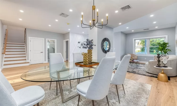 Dining room featuring light hardwood / wood-style flooring and vaulted ceiling