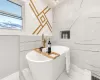 Bathroom featuring a tub to relax in