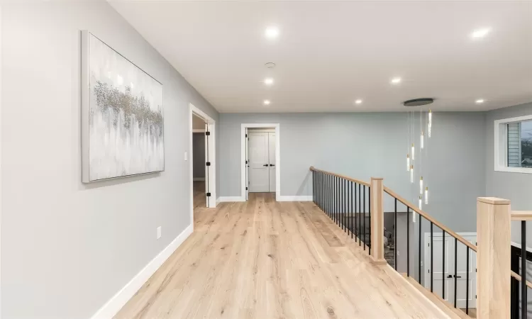 Hall featuring light hardwood / wood-style floors