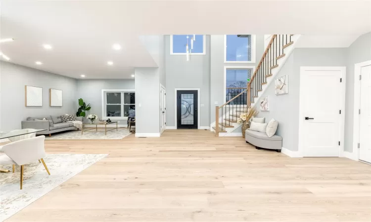 Foyer entrance featuring light hardwood / wood-style floors