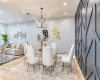 Dining area with an inviting chandelier and light wood-type flooring