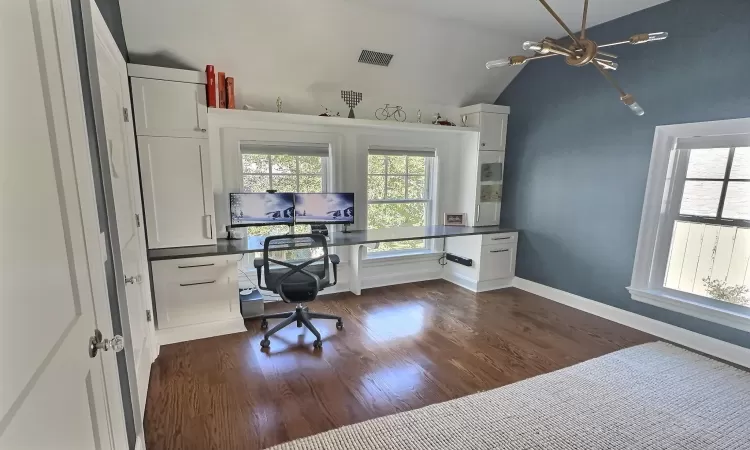 Office featuring vaulted ceiling and dark wood-type flooring