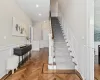 Stairs featuring parquet flooring and crown molding