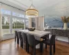 Dining room with crown molding and dark parquet floors