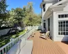 Wooden deck with a playground and outdoor lounge area