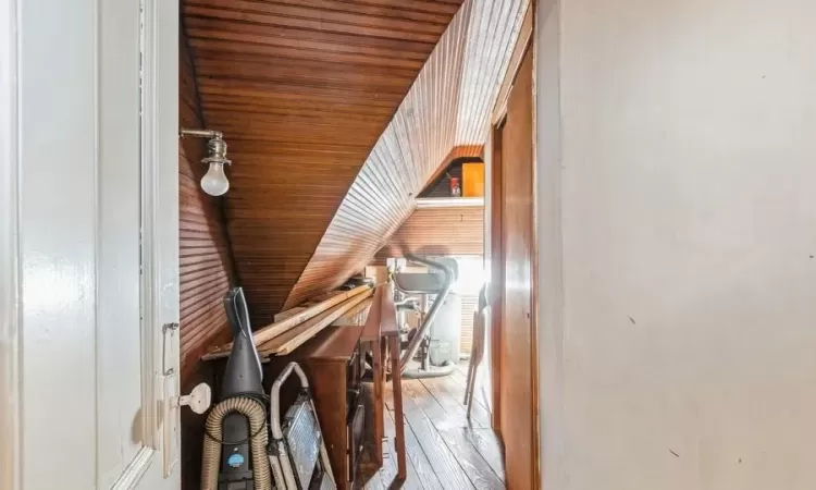 Hall featuring wood ceiling and vaulted ceiling