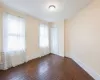 Spare room featuring dark hardwood / wood-style flooring