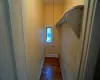 Kitchen featuring white cabinets, stainless steel gas range, radiator, light hardwood / wood-style floors, and sink