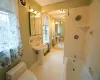 Basement Laundry Area with sink, plenty of natural light, and washer and dryer