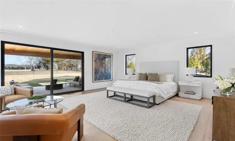 Bedroom with access to outside and light wood-type flooring