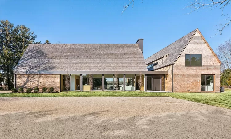 View of front of property featuring a front lawn