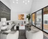 Living room with vaulted ceiling and hardwood / wood-style flooring