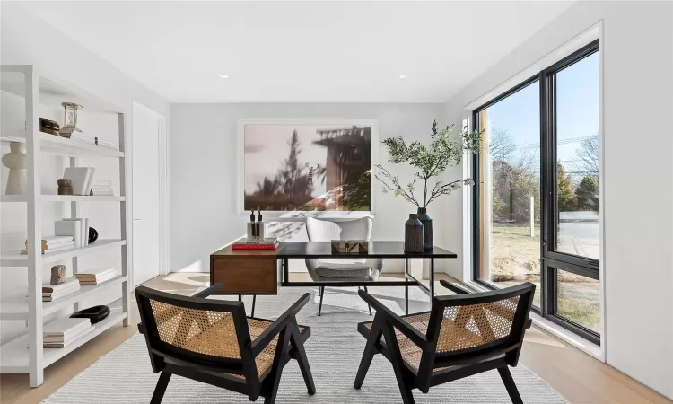 Dining room featuring light wood-type flooring and built in features