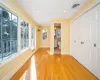 Bedroom with hardwood / wood-style floors and ensuite bathroom